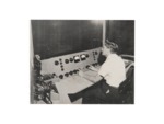 Eddie Smith behind the console of the recording studio