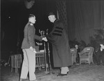 Kenneth C. Royall and ROTC student during commencement