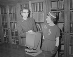 Booklovers Association officers and microfilm reader