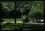 Individual Walking Across the Academic Mall by Gregory Rust